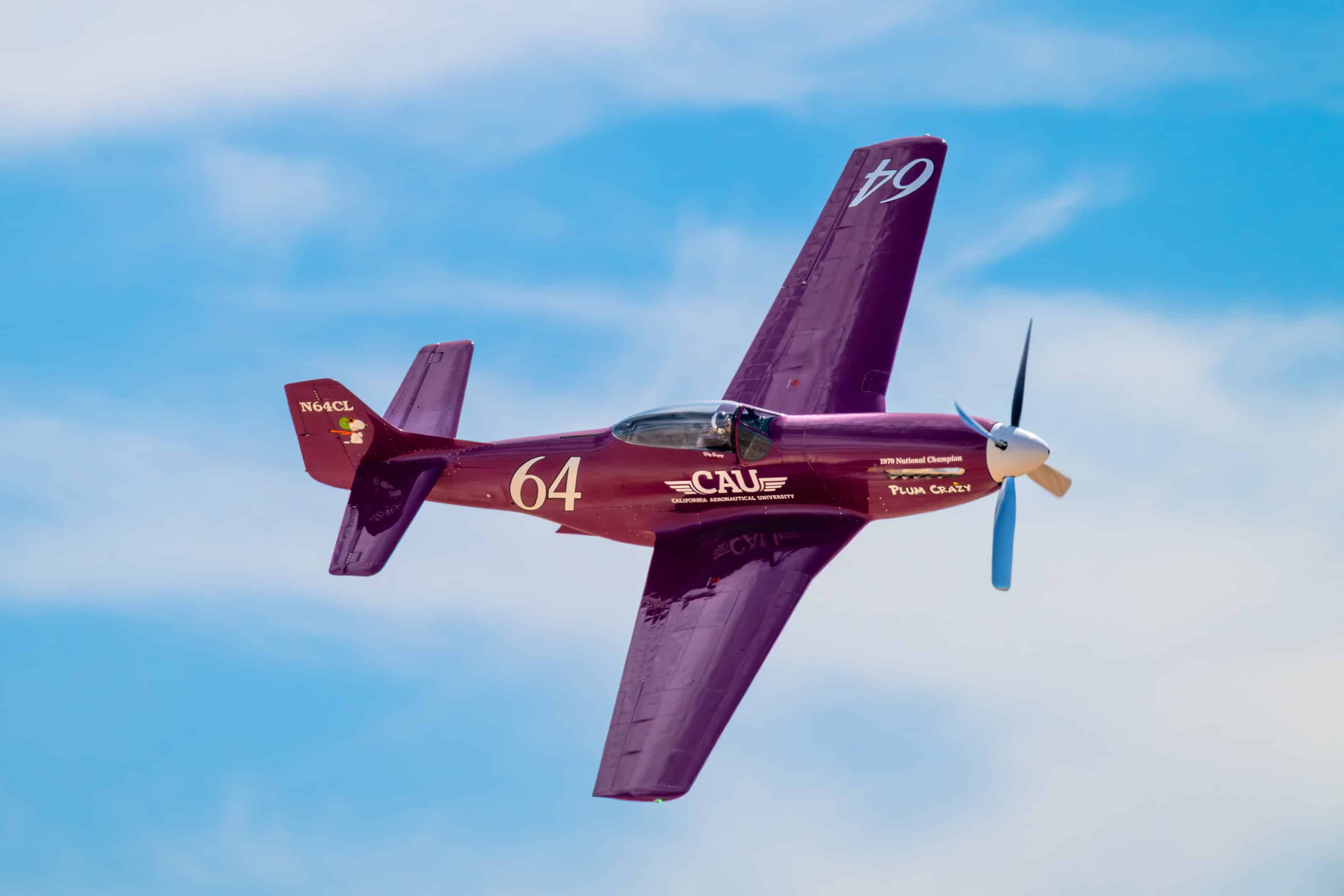 Photo of Vicky Benzing tearing through the skies at the Thunder and Lightning Over Arizona air show at Davis Monthan Air Force Base in her P-51D, the Plum Crazy